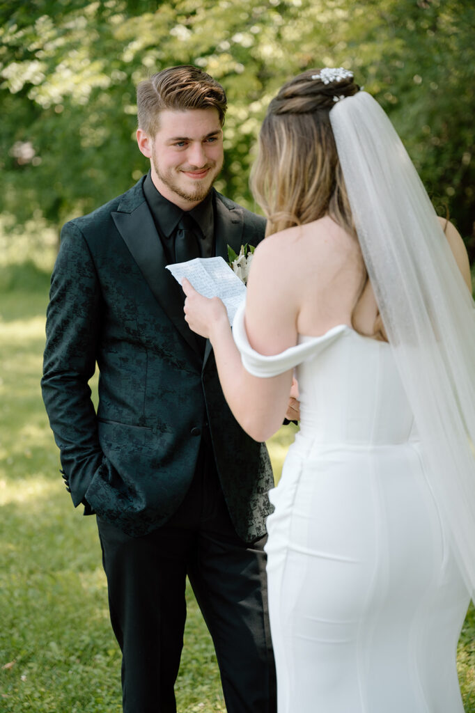 Bride reading vows to groom