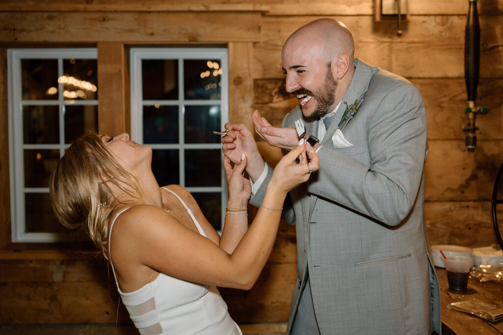 Bride and groom sharing wedding cake