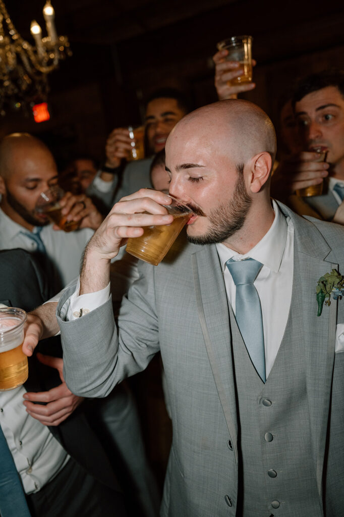 Groom chugging beer